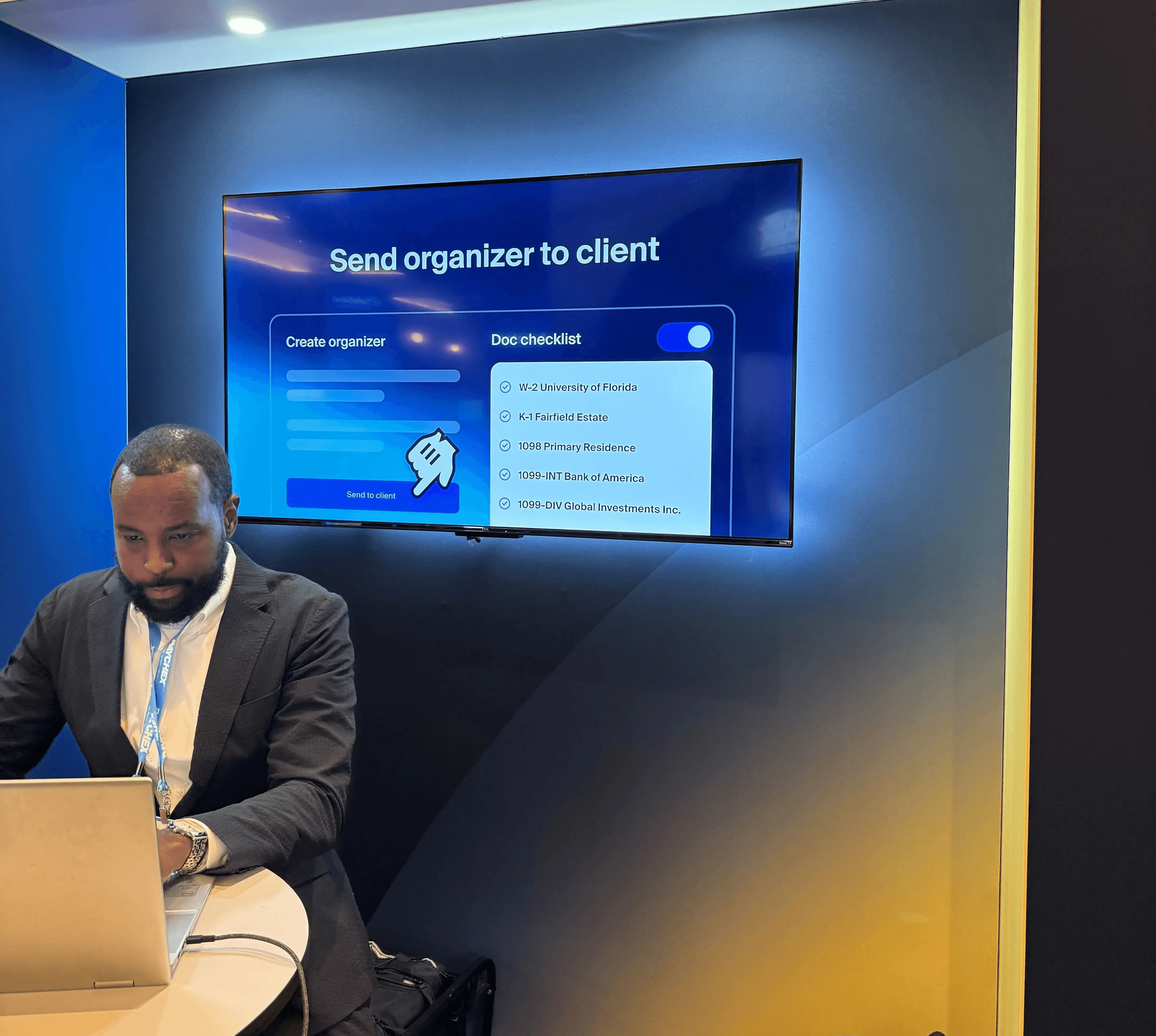 Max on stage at the Las Vegas forum demoing “Send organizer to client”